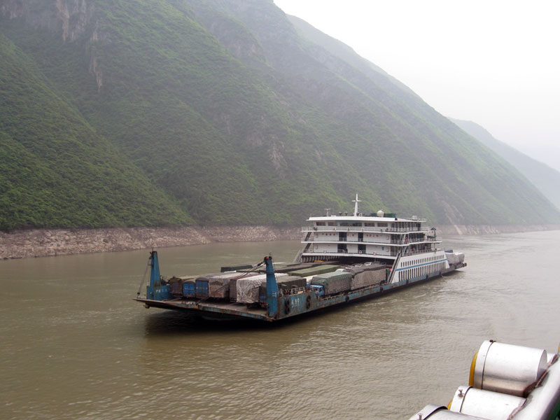 Passing a boat full of loaded trucks ... click to see a larger image
